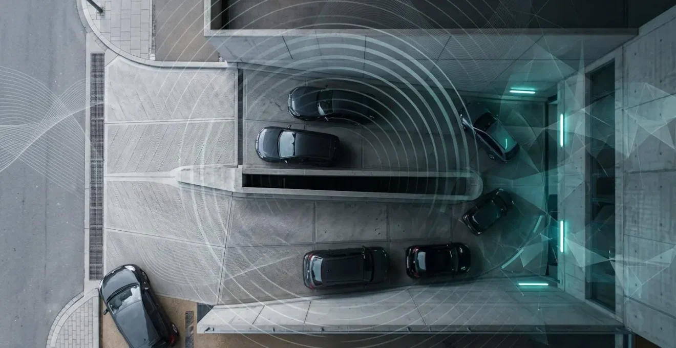Vue aérienne d'un parking souterrain avec signal GPS et ondes radio représentés de manière abstraite